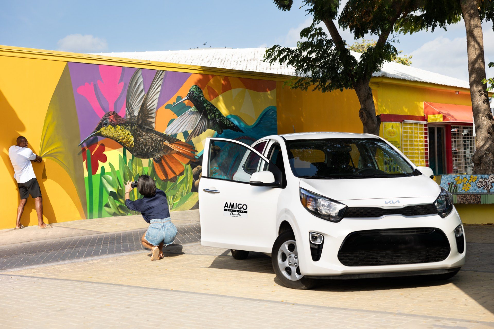 A rental car in front of Aruba's colourful street-art murals