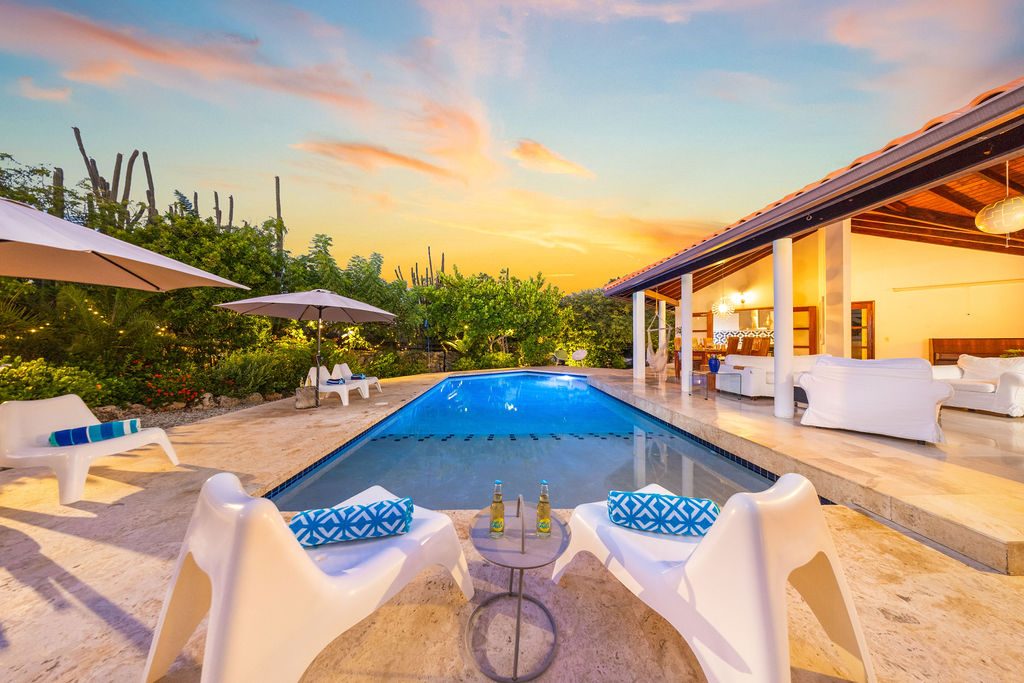 Maxwell Luxury Villa — pool and open-air living at sunset, Aruba
