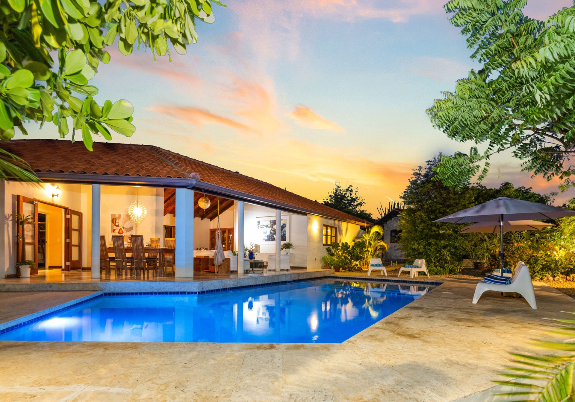 Naïma Luxury Cottage at sunset — pool, terrace and garden, Aruba